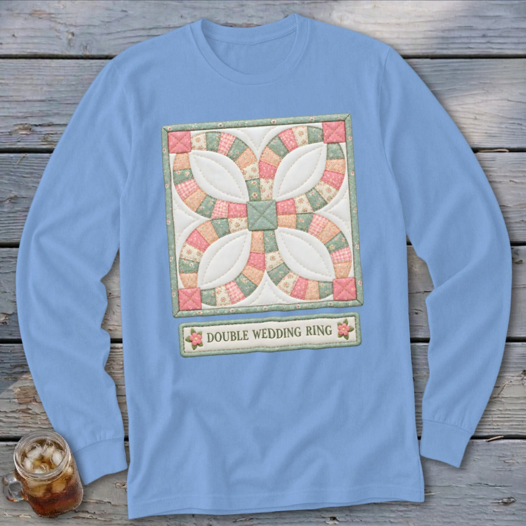 Light blue long sleeve shirt with a Double Wedding Ring quilt pattern and text.