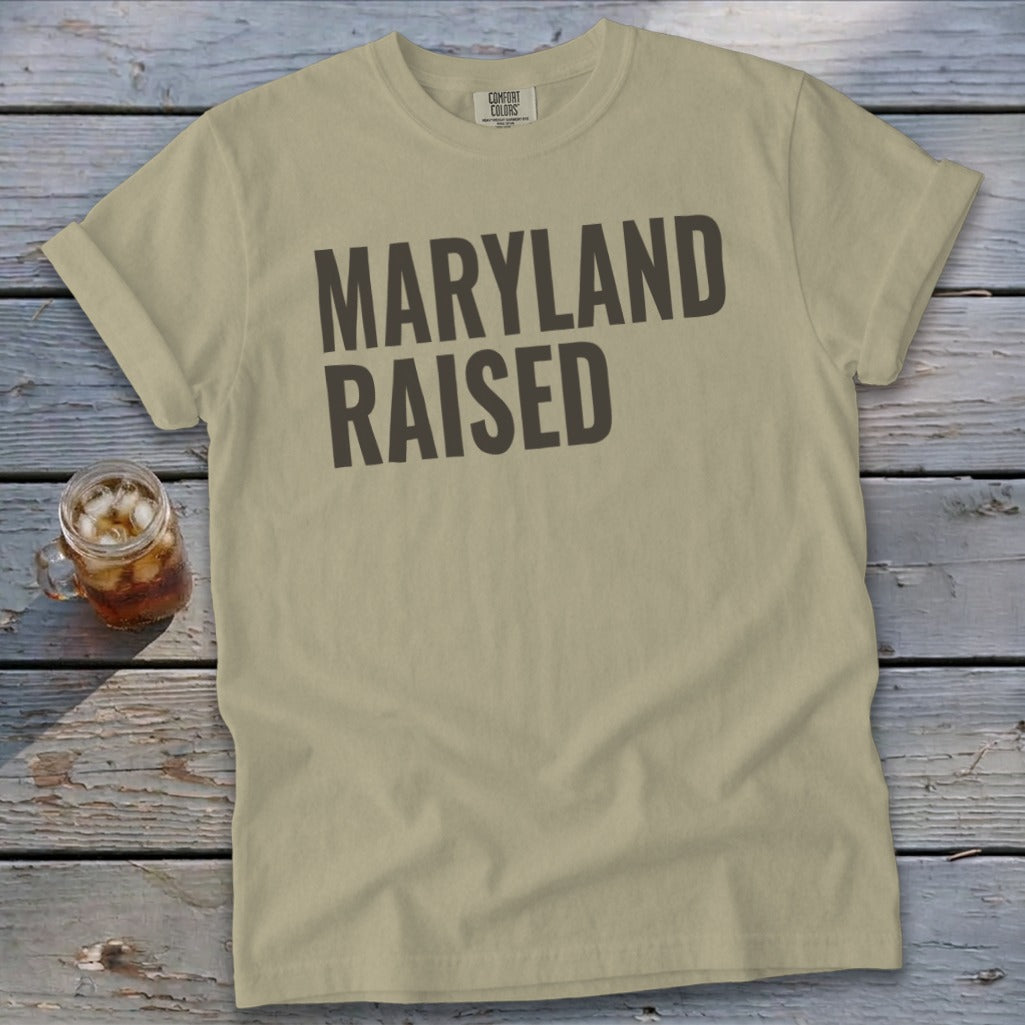 Khaki t-shirt with "Maryland Raised" text and a glass of iced tea.