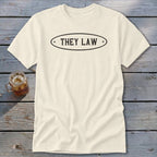 Cream t-shirt with oval black graphic reading "THEY LAW"
