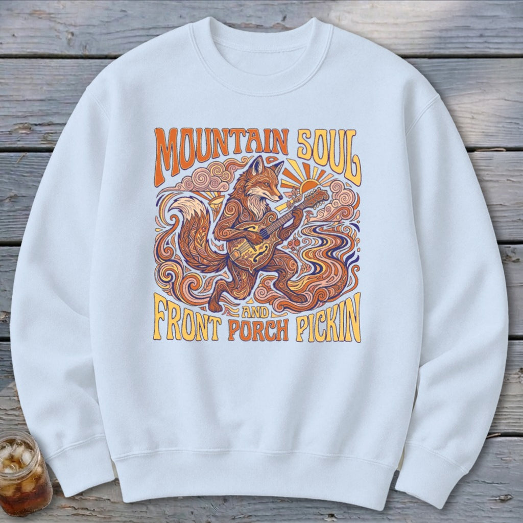 Graphic sweatshirt featuring a fox playing guitar, with text "Mountain Soul and Front Porch Pickin'".