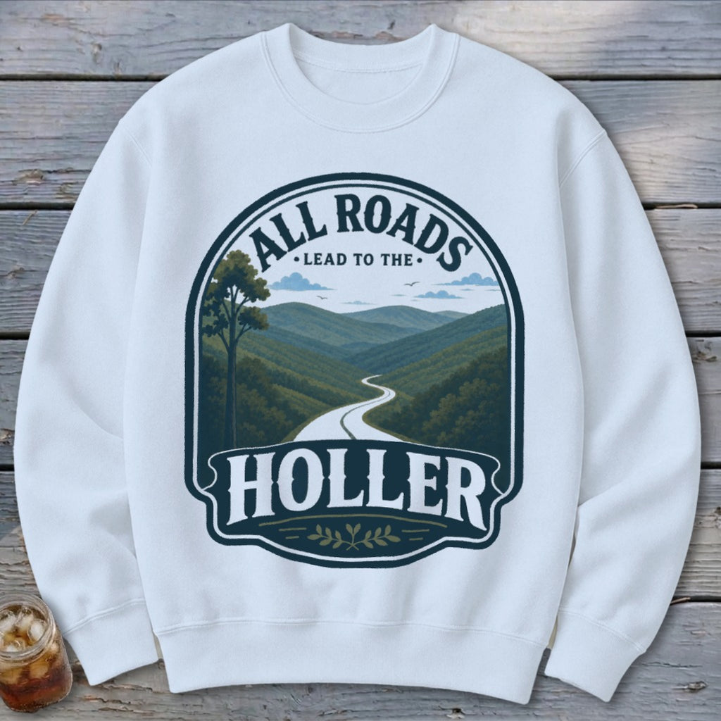 White sweatshirt with "All Roads Lead to the Holler" graphic featuring a mountain road.