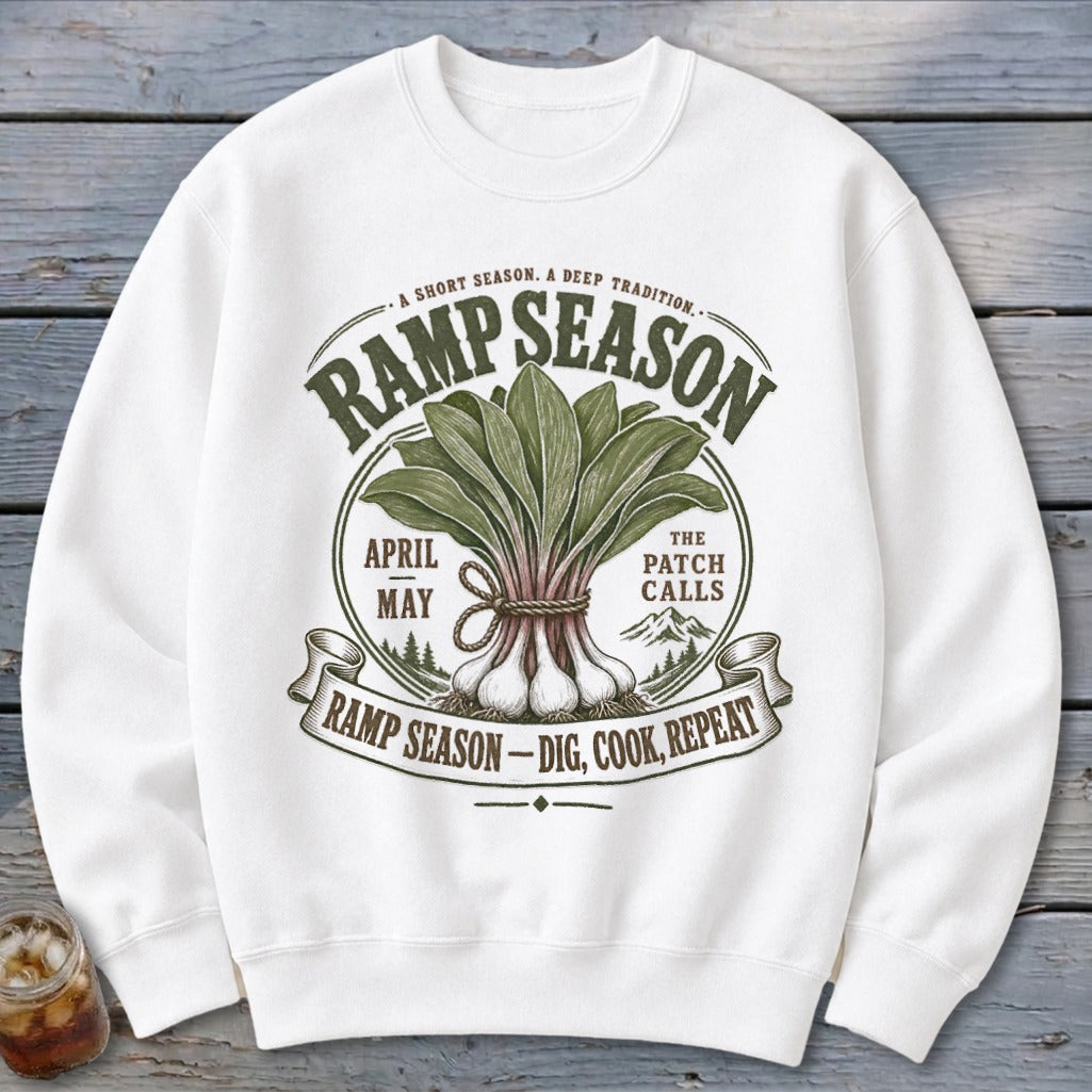 White sweatshirt with "Ramp Season" graphic, depicting ramps and mountains.