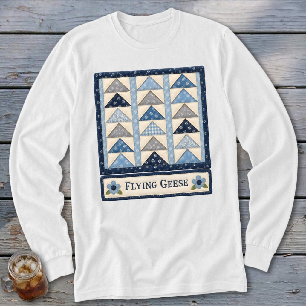 Long sleeve white shirt featuring a blue and gray flying geese quilt pattern.