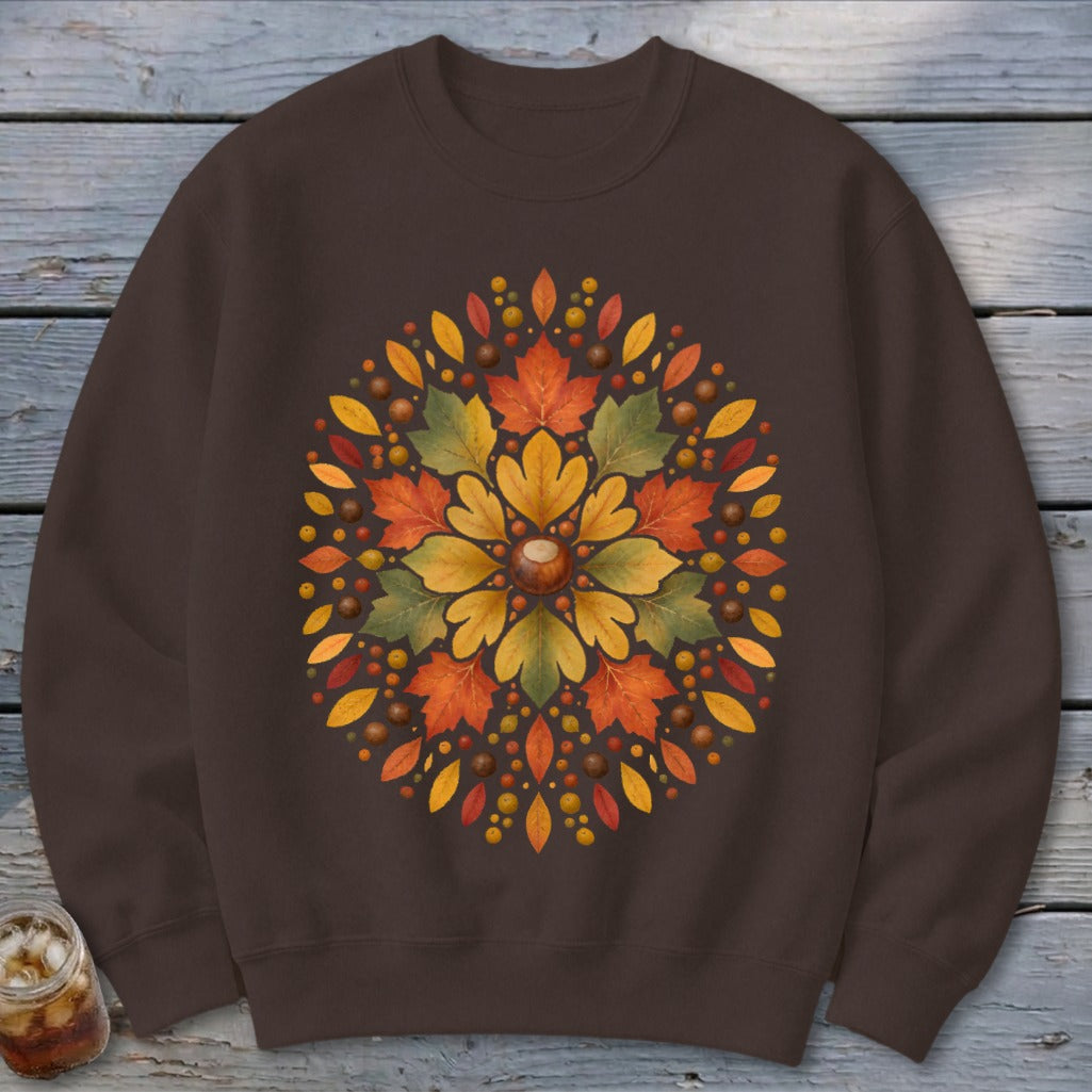 Brown sweatshirt with a circular autumn leaf and berry design.