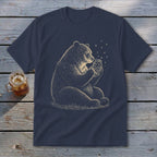 T-shirt with a line drawing of a bear holding a jar with fireflies.