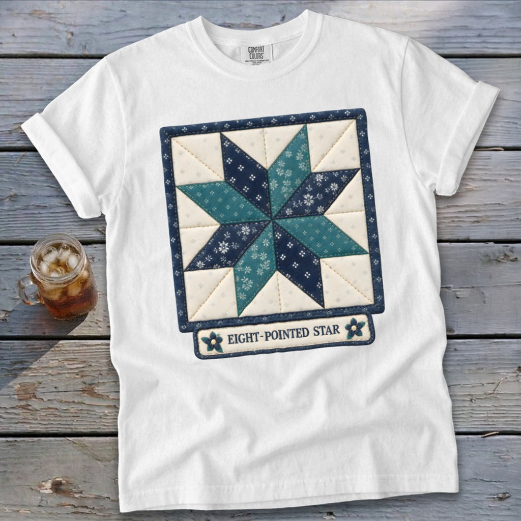 White t-shirt with an eight-pointed star quilt design and text.