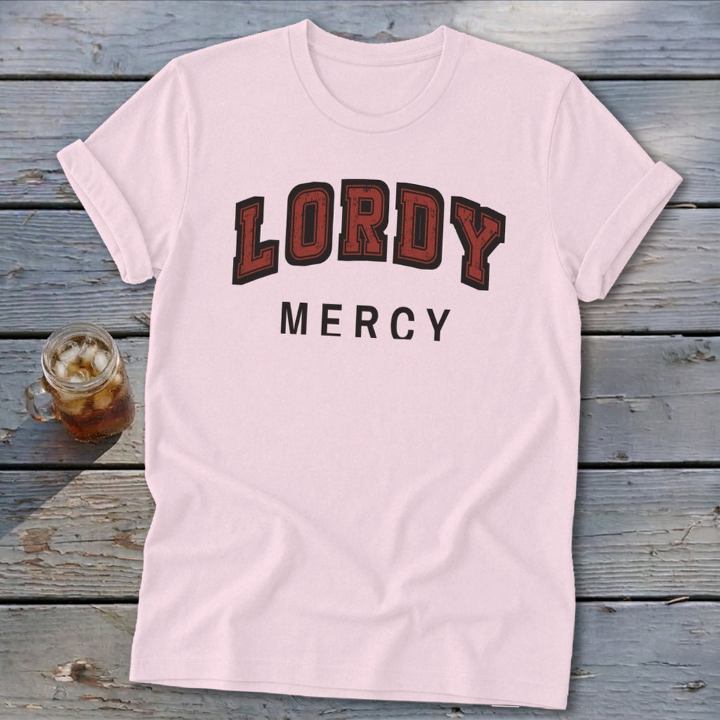 Pink t-shirt with red and black "LORDY MERCY" text on the chest.