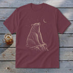Maroon t-shirt with graphic of a bear sitting on a rock looking at the moon and stars.