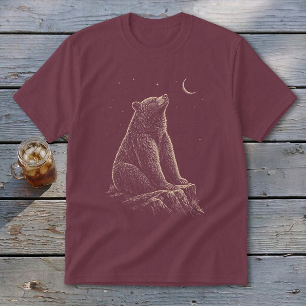 Maroon t-shirt with graphic of a bear sitting on a rock looking at the moon and stars.