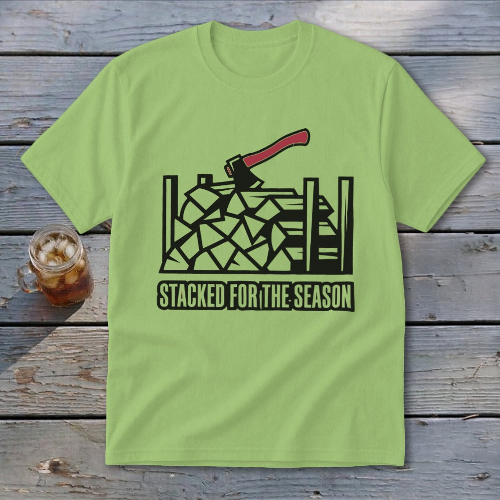 Light green t-shirt with black graphic of stacked firewood, axe, and text.
