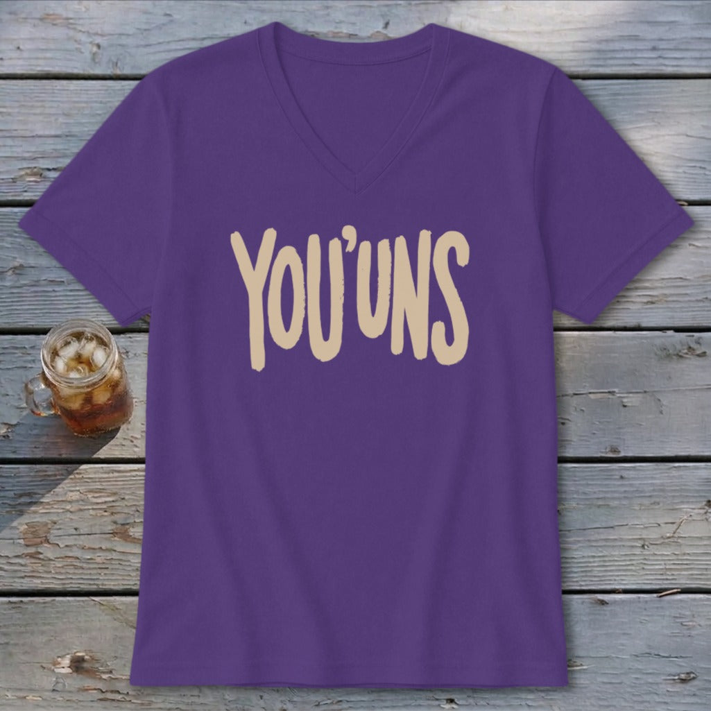 Purple v-neck t-shirt with "YOU' UNS" text in tan.