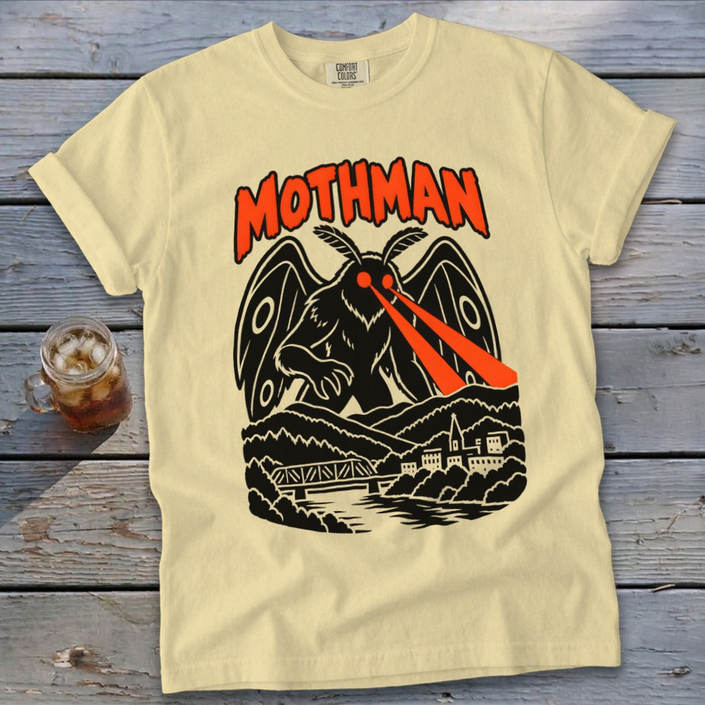 Cream t-shirt with black and red Mothman graphic featuring red laser eyes.