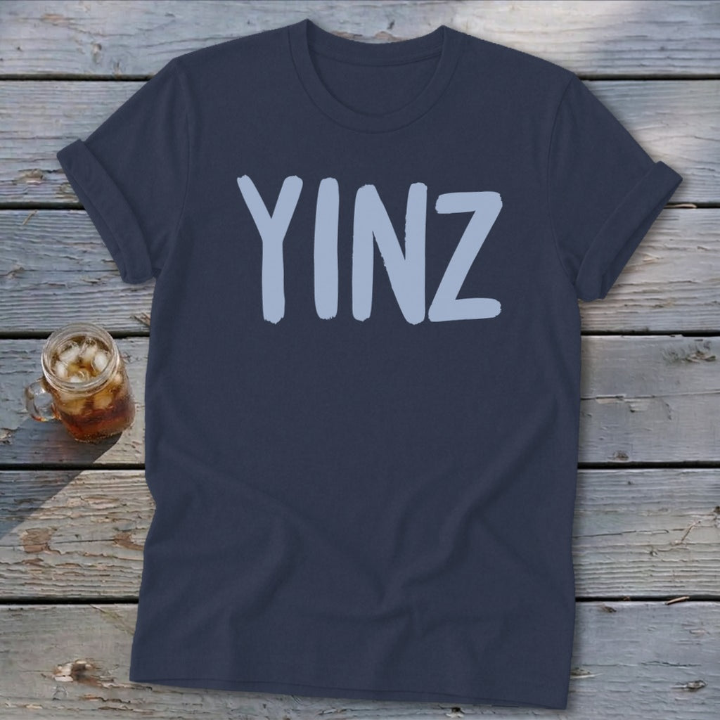 Navy t-shirt with light blue "YINZ" text.
