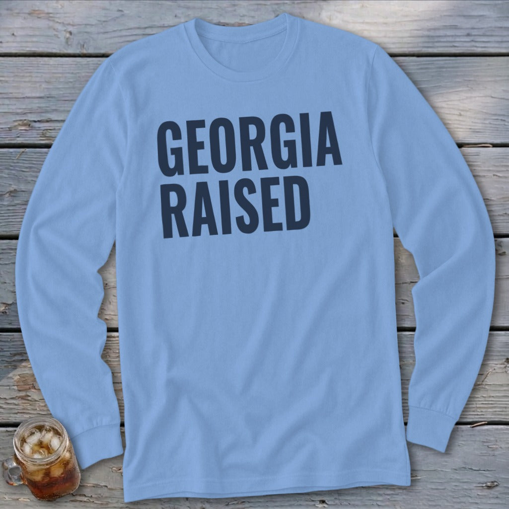 Light blue long-sleeve shirt with "GEORGIA RAISED" in dark blue text.