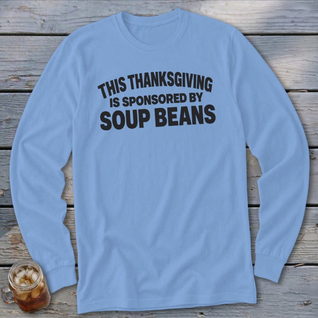 A light blue long-sleeved t-shirt with the black text "THIS THANKSGIVING IS SPONSORED BY SOUP BEANS."