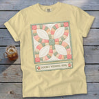 Yellow t-shirt with a double wedding ring quilt design and text.