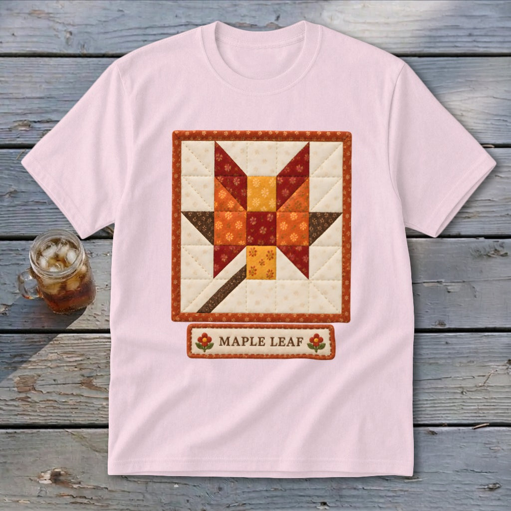 Light pink t-shirt with a quilted maple leaf design and the words "Maple Leaf."