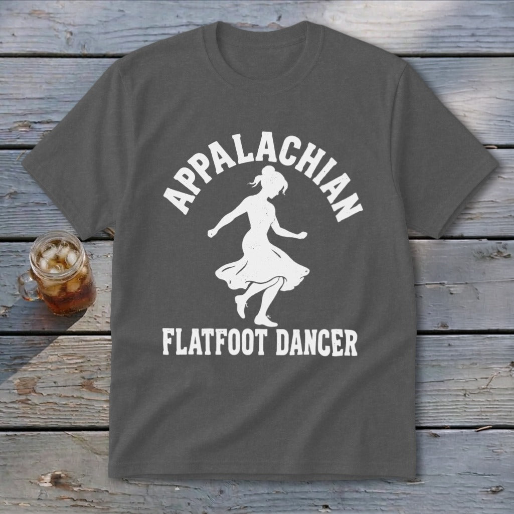 A dark gray t-shirt with a white graphic of a dancer and the text Appalachian Flatfoot Dancer.