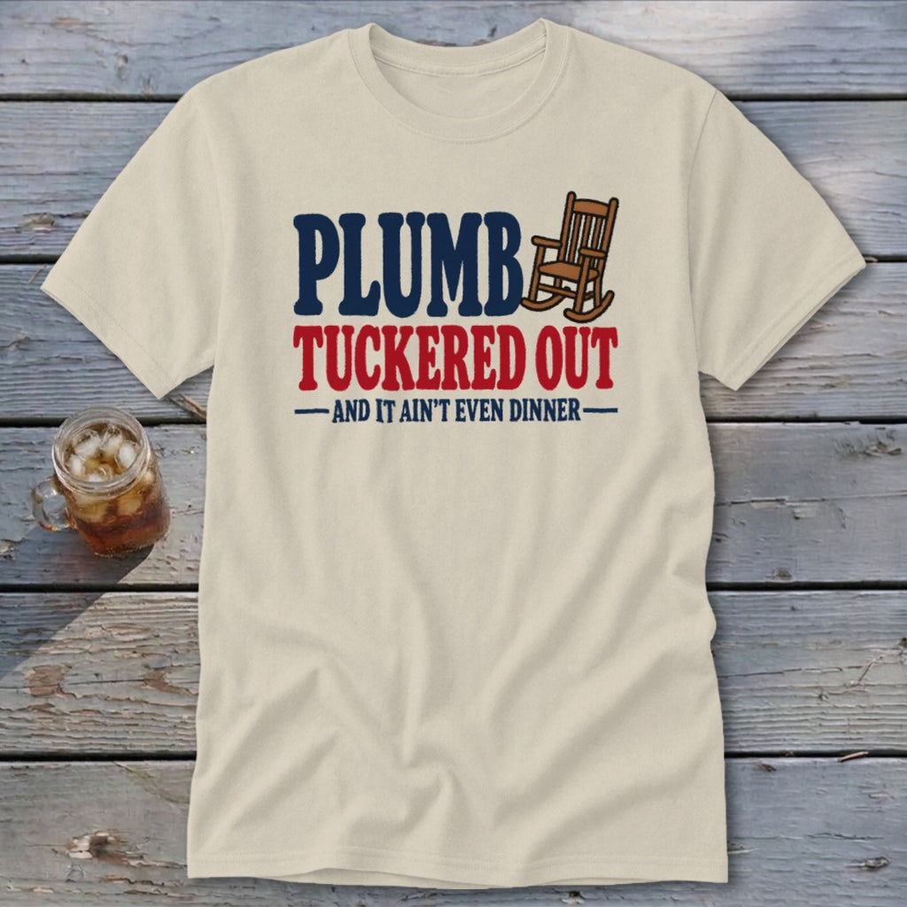 Cream t-shirt with text "PLUMB TUCKRED OUT AND IT AIN'T EVEN DINNER" and a rocking chair.