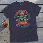 Navy t-shirt with text "A TOBOGGAN IS FOR MY NOGGAN" and a winter hat graphic.