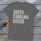 Gray t-shirt with "SOUTH CAROLINA RAISED" text.