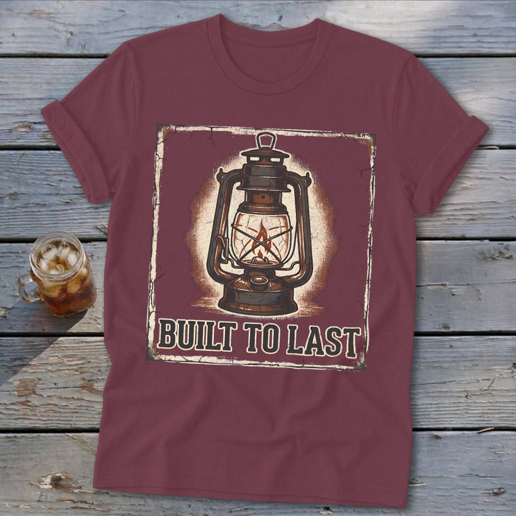 Burgundy t-shirt with vintage lantern graphic and "BUILT TO LAST" text.