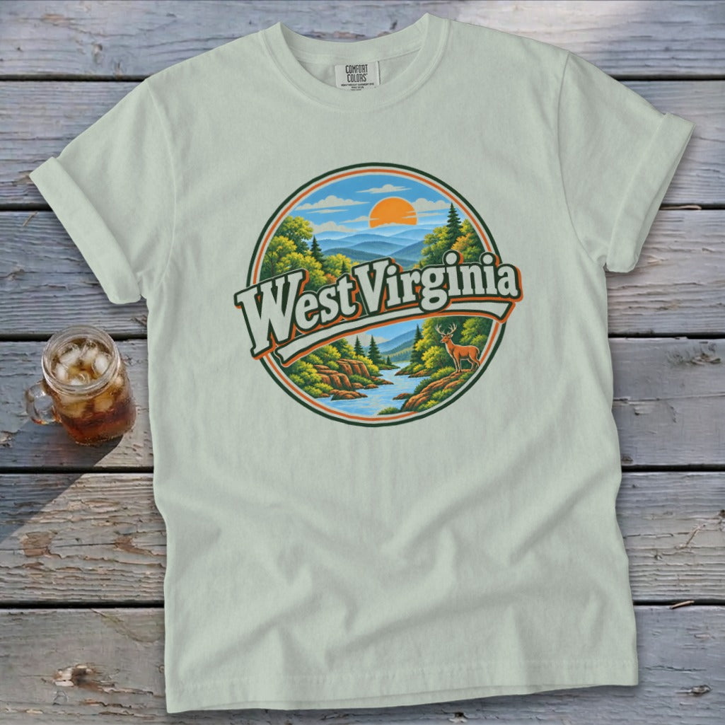 Light blue t-shirt with a circular graphic of West Virginia mountains, river, and deer.