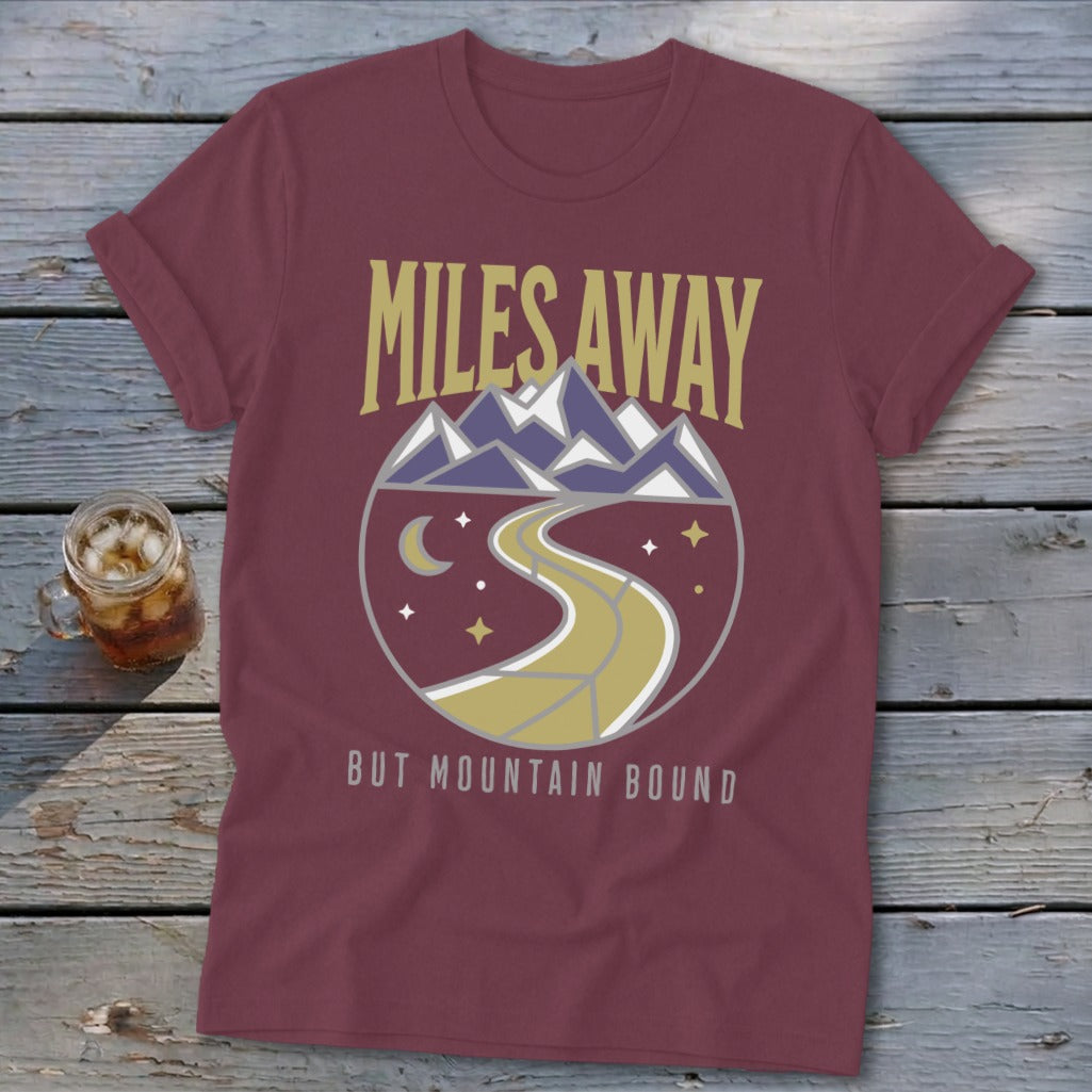 Maroon t-shirt with "Miles Away But Mountain Bound" graphic.