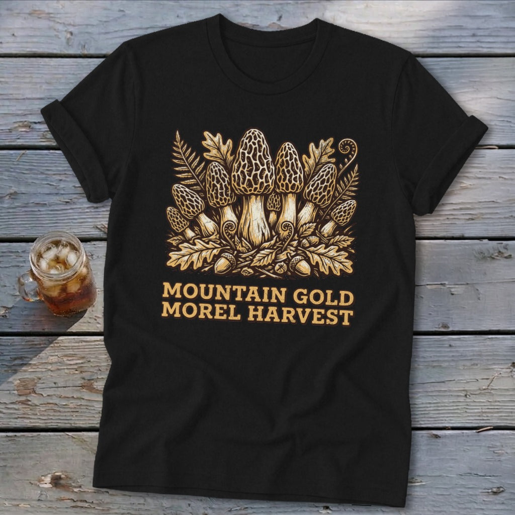 Black t-shirt with gold morel mushroom and foliage graphic and text "MOUNTAIN GOLD MOREL HARVEST".