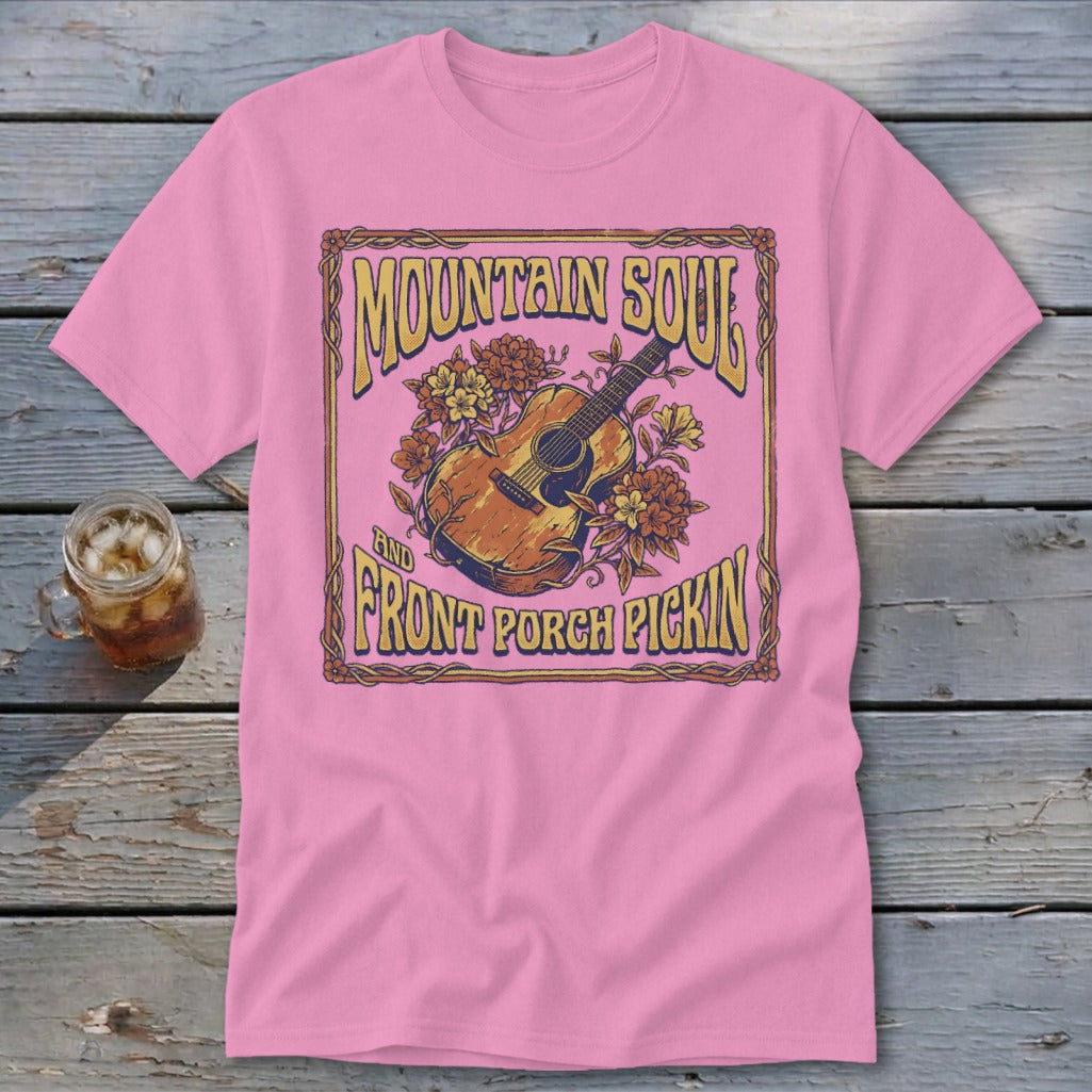 Pink t-shirt with "Mountain Soul and Front Porch Pickin'" text and acoustic guitar graphic.