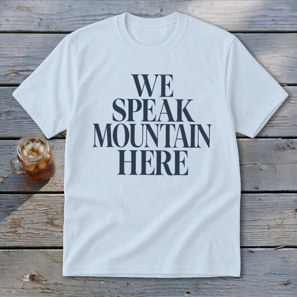 White t-shirt with navy text reading "WE SPEAK MOUNTAIN HERE".