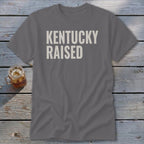 Gray t-shirt with "KENTUCKY RAISED" in white text.